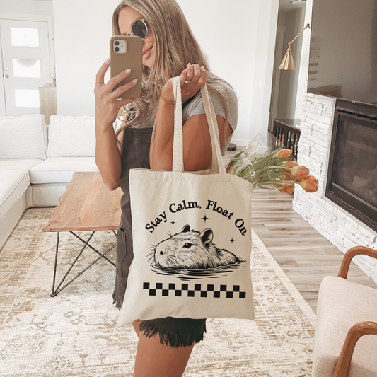 Stay Calm, Float On” Capybara Tote Bag